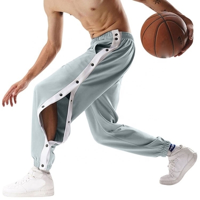 Botões laterais personalizados para homens de treino de basquetebol com listras Calças de tênis de poliéster com pernas abertas