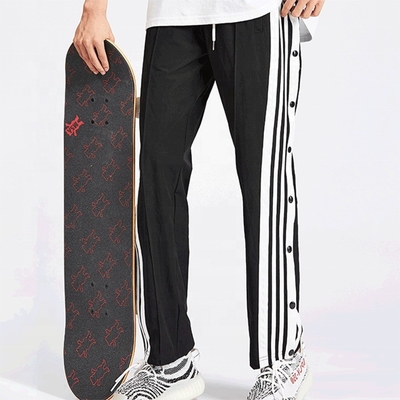 Calças de pista de skate hip hop customizadas para homens com faixa lateral e botões